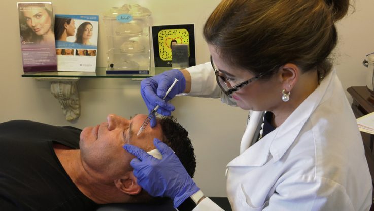 Dr. Anne Taylor gives a patient Botox injections in her Columbus, Ohio office. New statistics from the American Society of Plastic Surgeons reveals that minimally invasive procedures have risen more than 75% among men since 2000.
